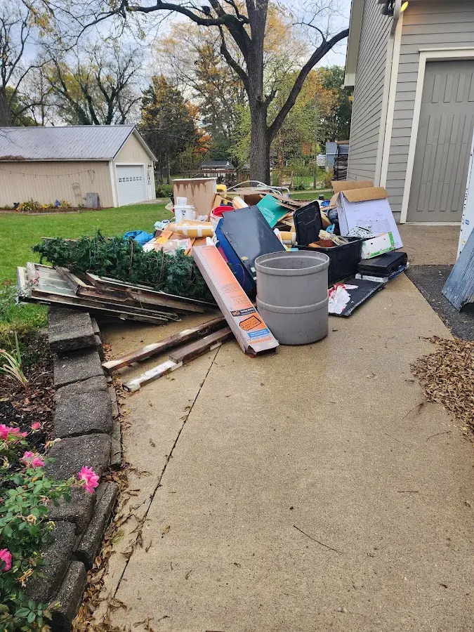 Dumpster being loaded with debris for Demolition Dumpster Rental in Whitehall